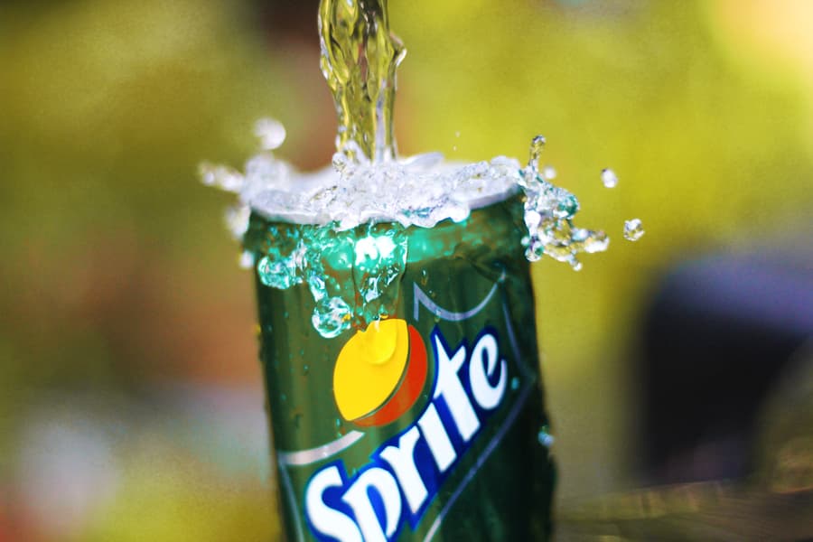 Water pouring in sprite bottle